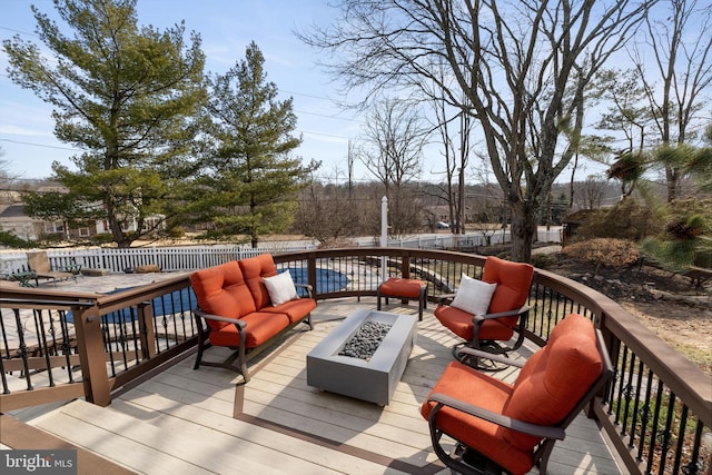 deck with an outdoor fire pit