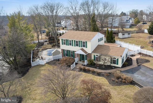 birds eye view of property with a residential view