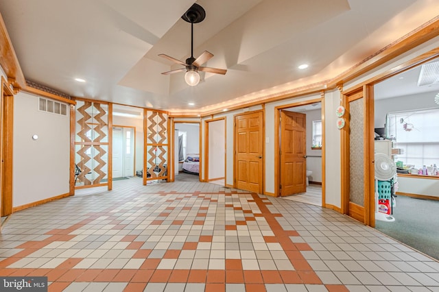 below grade area with ceiling fan, recessed lighting, visible vents, and baseboards