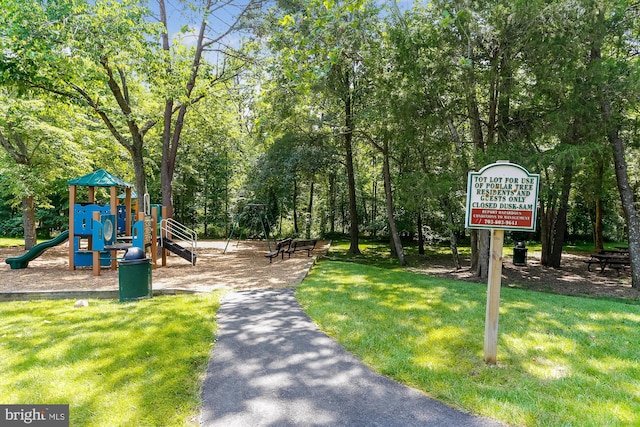 community play area featuring a lawn