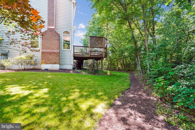 view of yard with a wooden deck