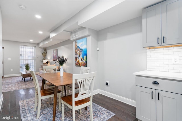 dining area with visible vents, baseboards, dark wood-style flooring, and recessed lighting