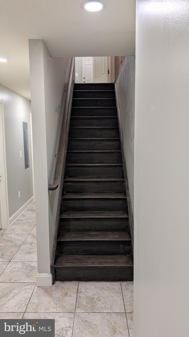 staircase with baseboards and recessed lighting