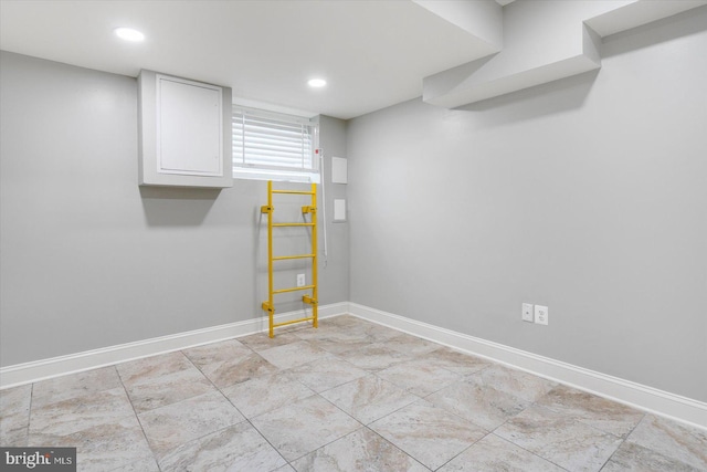 unfurnished room with baseboards and recessed lighting