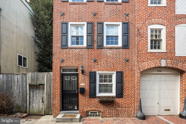 multi unit property with fence and brick siding