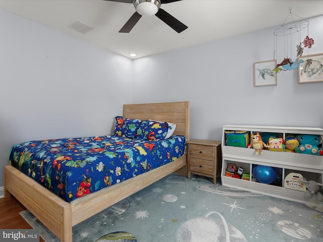 bedroom featuring visible vents and ceiling fan
