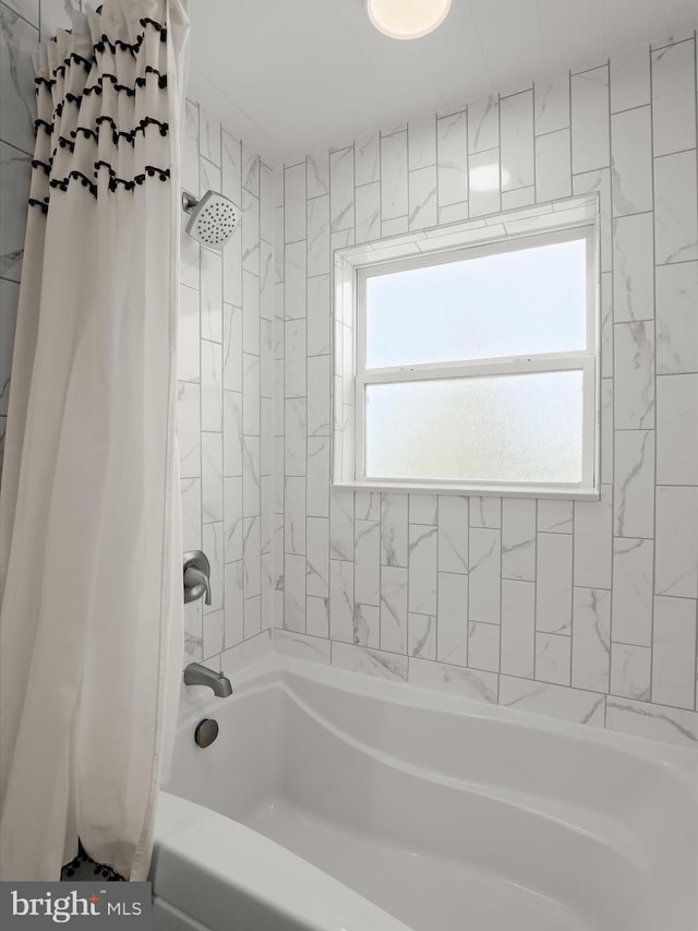 full bathroom featuring shower / bathtub combination with curtain