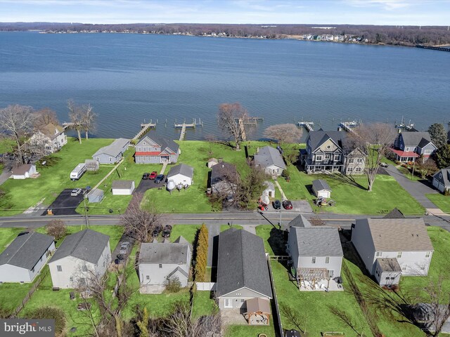 birds eye view of property featuring a residential view and a water view