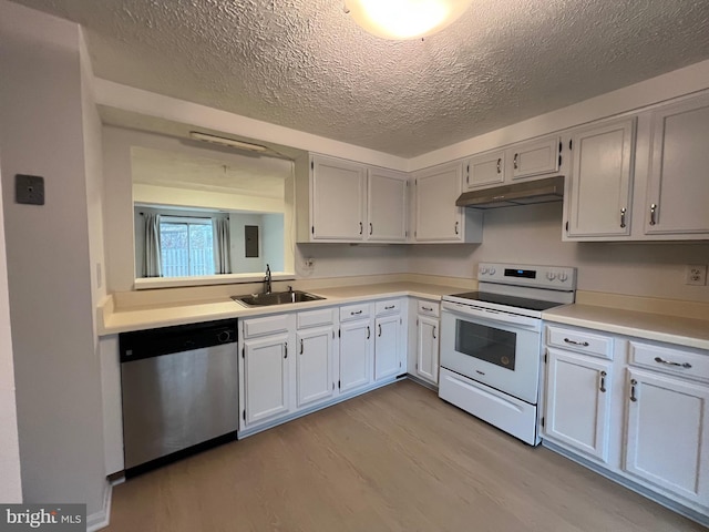 kitchen featuring electric stove, dishwasher, light countertops, under cabinet range hood, and a sink