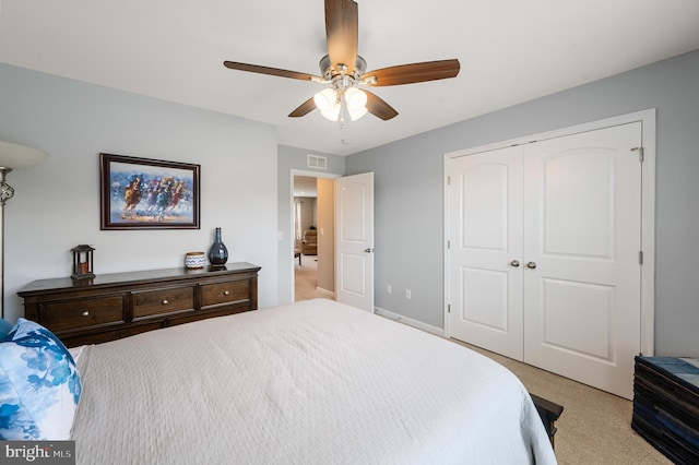 bedroom with ceiling fan, visible vents, baseboards, a closet, and carpet