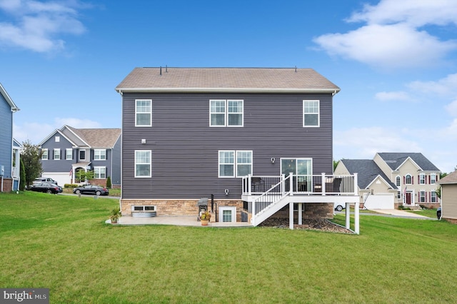 rear view of property with a wooden deck, stairs, a patio, and a yard