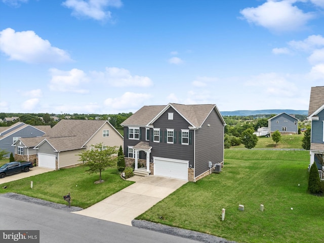 traditional home featuring an attached garage, stone siding, concrete driveway, and a front yard