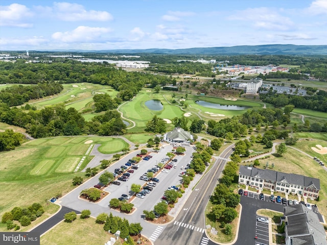 aerial view featuring view of golf course and a water view