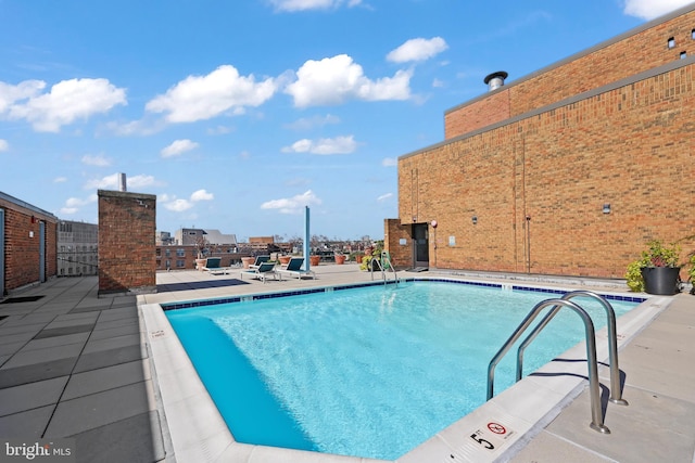 pool featuring a patio area and fence