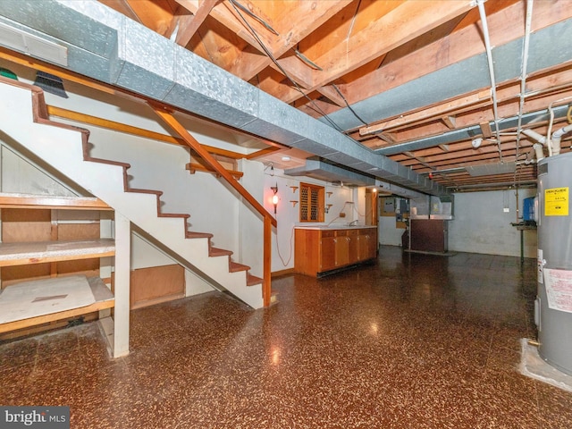 unfinished basement with water heater and stairway