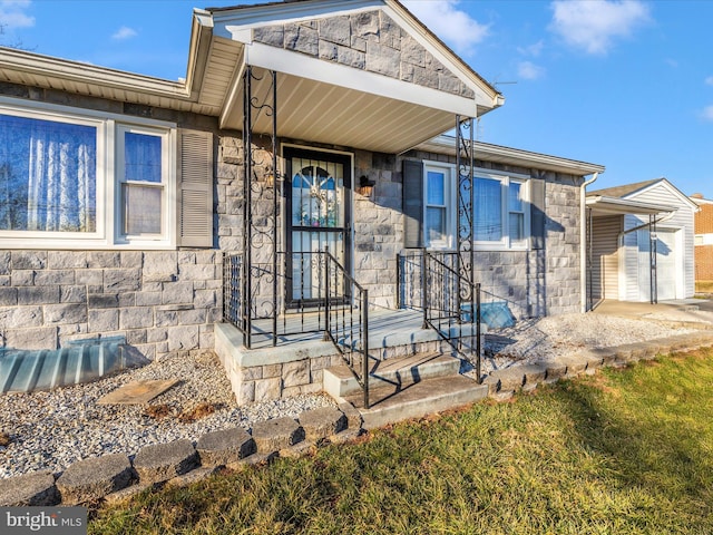 doorway to property featuring stone siding