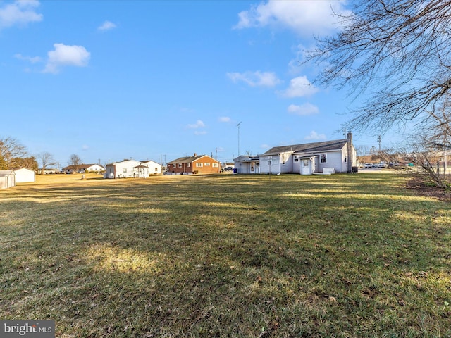 view of yard featuring a residential view