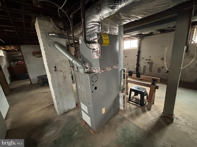 utility room with heating unit