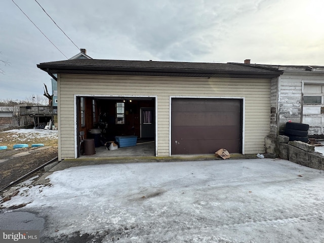 view of snow covered garage