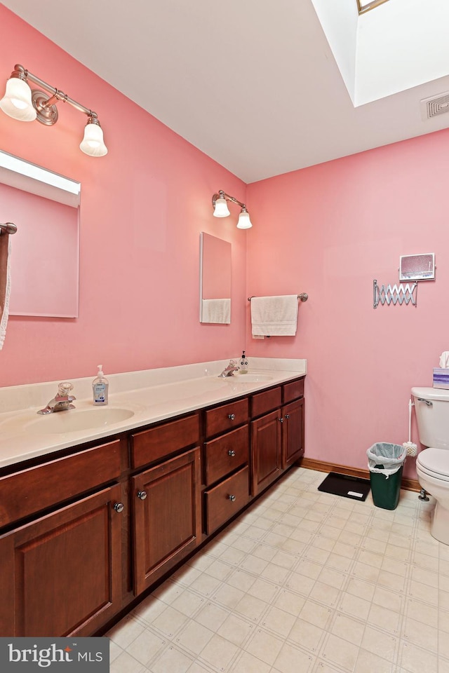 20 Glade Ave, Baltimore, MD 21236 - full bath with toilet, double vanity, tile patterned floors, and baseboards