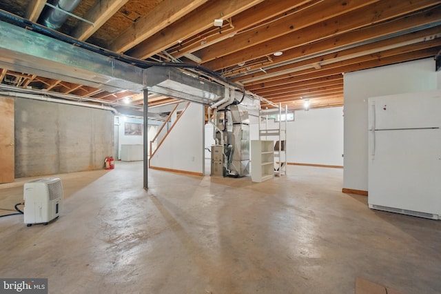 20 Glade Ave, Baltimore, MD 21236 - unfinished below grade area with freestanding refrigerator, heating unit, and baseboards