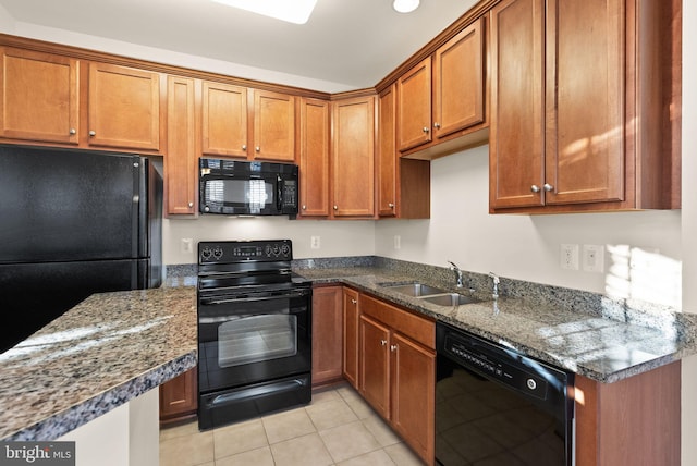 8610 Liberty Trl Unit 102, Manassas, VA 20110 - kitchen with brown cabinetry, a sink, and black appliances