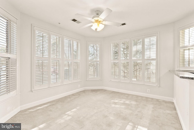 8610 Liberty Trl Unit 102, Manassas, VA 20110 - spare room featuring light carpet, visible vents, baseboards, and a ceiling fan