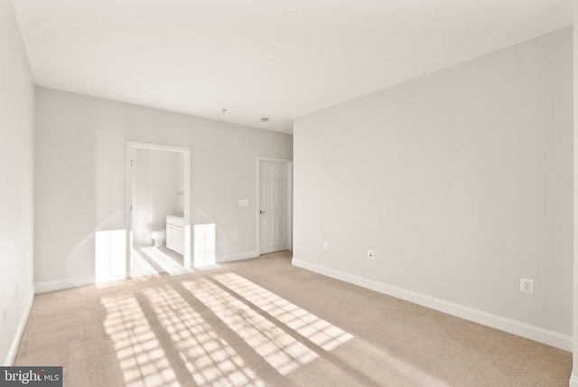 8610 Liberty Trl Unit 102, Manassas, VA 20110 - unfurnished bedroom featuring baseboards and light colored carpet