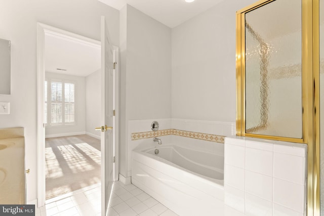 8610 Liberty Trl Unit 102, Manassas, VA 20110 - bathroom with a shower with door, tile patterned flooring, and a bath