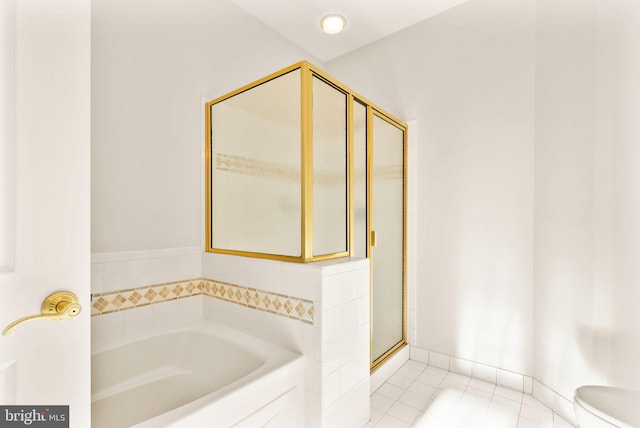8610 Liberty Trl Unit 102, Manassas, VA 20110 - full bathroom featuring toilet, a stall shower, a bath, baseboards, and tile patterned floors