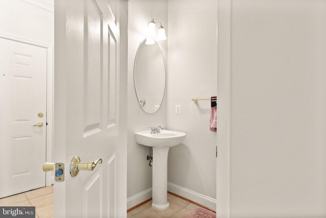 8610 Liberty Trl Unit 102, Manassas, VA 20110 - bathroom with a sink, baseboards, and tile patterned floors