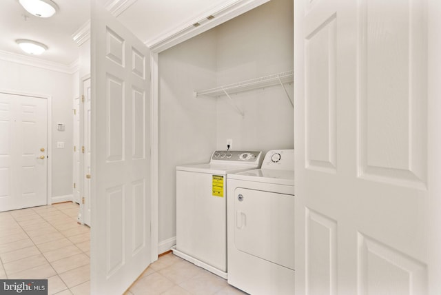 8610 Liberty Trl Unit 102, Manassas, VA 20110 - laundry area featuring laundry area, baseboards, ornamental molding, washer and dryer, and light tile patterned flooring