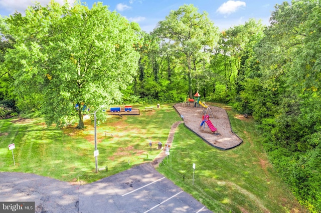 8610 Liberty Trl Unit 102, Manassas, VA 20110 - view of community with uncovered parking, a lawn, and playground community