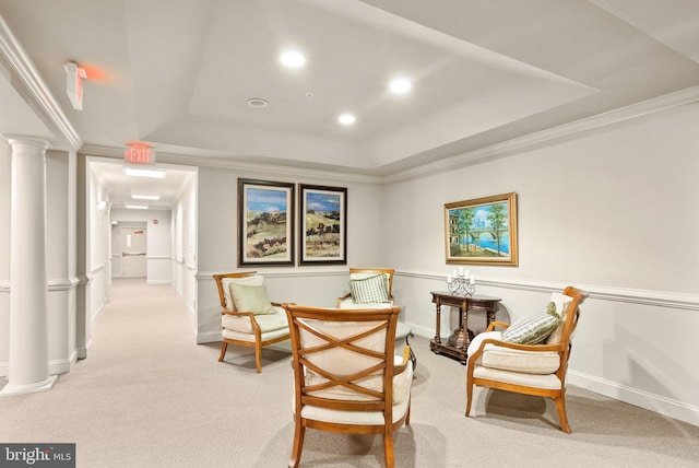 8610 Liberty Trl Unit 102, Manassas, VA 20110 - living area with crown molding, a tray ceiling, decorative columns, and light colored carpet