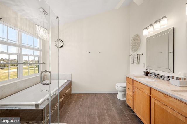 bathroom featuring double vanity, baseboards, a garden tub, an enclosed shower, and a sink