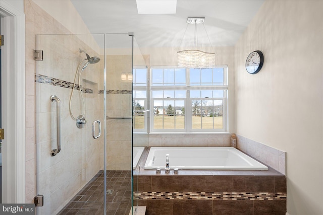 full bath featuring a garden tub and a shower stall