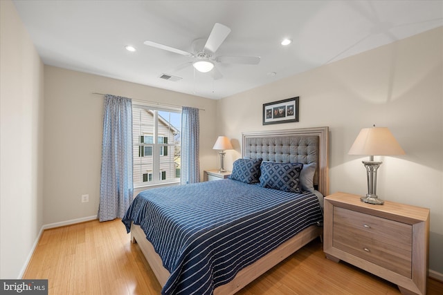 bedroom with recessed lighting, visible vents, light wood-style floors, a ceiling fan, and baseboards