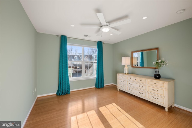 unfurnished bedroom with recessed lighting, visible vents, a ceiling fan, light wood-type flooring, and baseboards