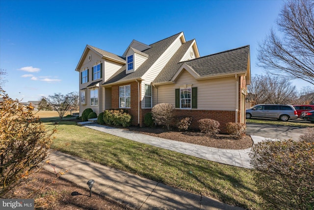 view of property exterior with a shingled roof, a lawn, and brick siding