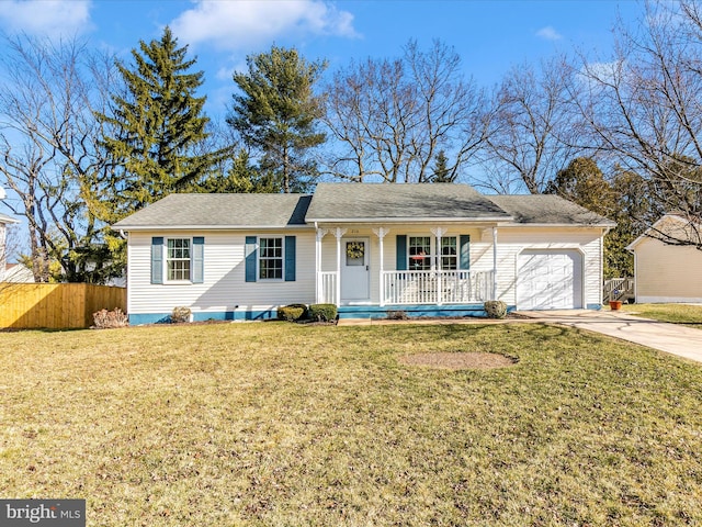 ranch-style home featuring an attached garage, covered porch, fence, driveway, and a front yard