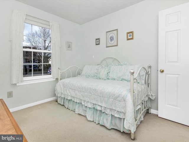 carpeted bedroom with baseboards