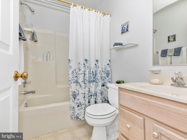 bathroom with vanity, shower / bath combo with shower curtain, and toilet