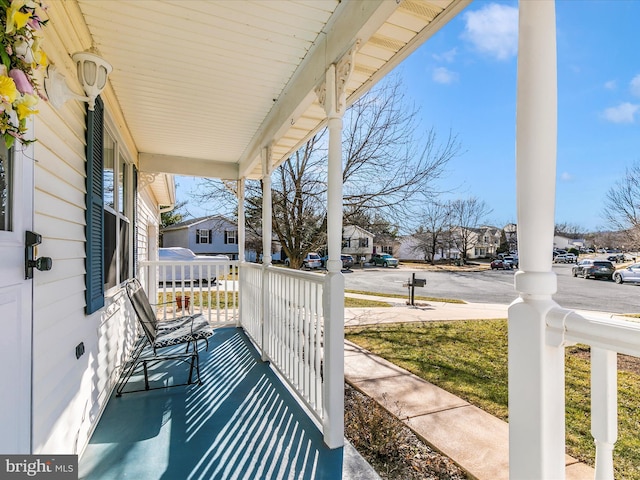 view of patio featuring a porch and a residential view