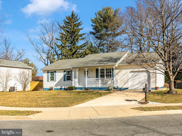 ranch-style home with covered porch, central AC unit, a garage, driveway, and a front lawn