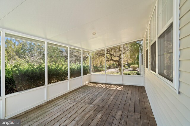 unfurnished sunroom featuring plenty of natural light