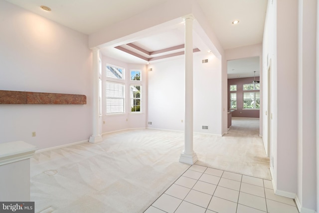 interior space with light carpet, visible vents, and baseboards