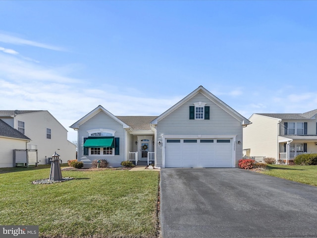 view of front of home with driveway, a garage, and a front lawn