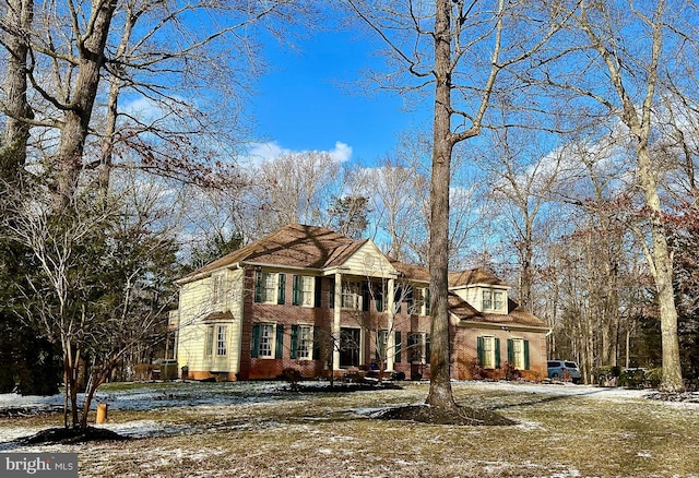 view of front of home featuring brick siding