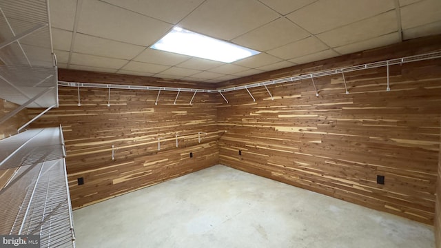 walk in closet with a paneled ceiling