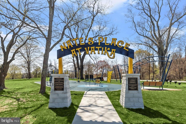 view of property's community featuring playground community and a lawn